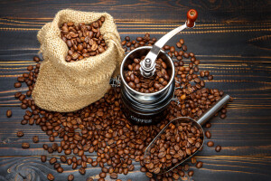 roasted coffee beans on dark wooden background